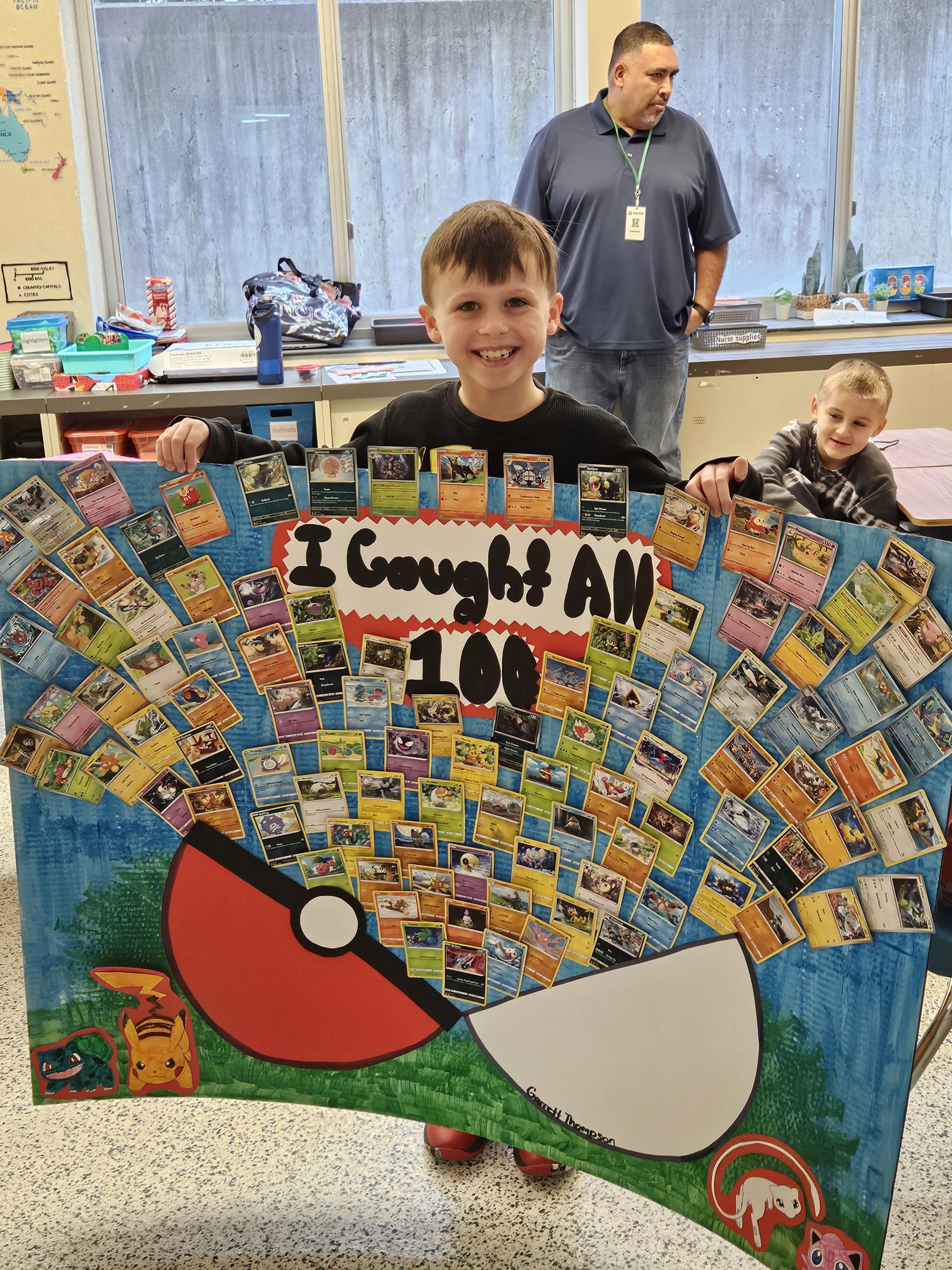 Boy stands with poster