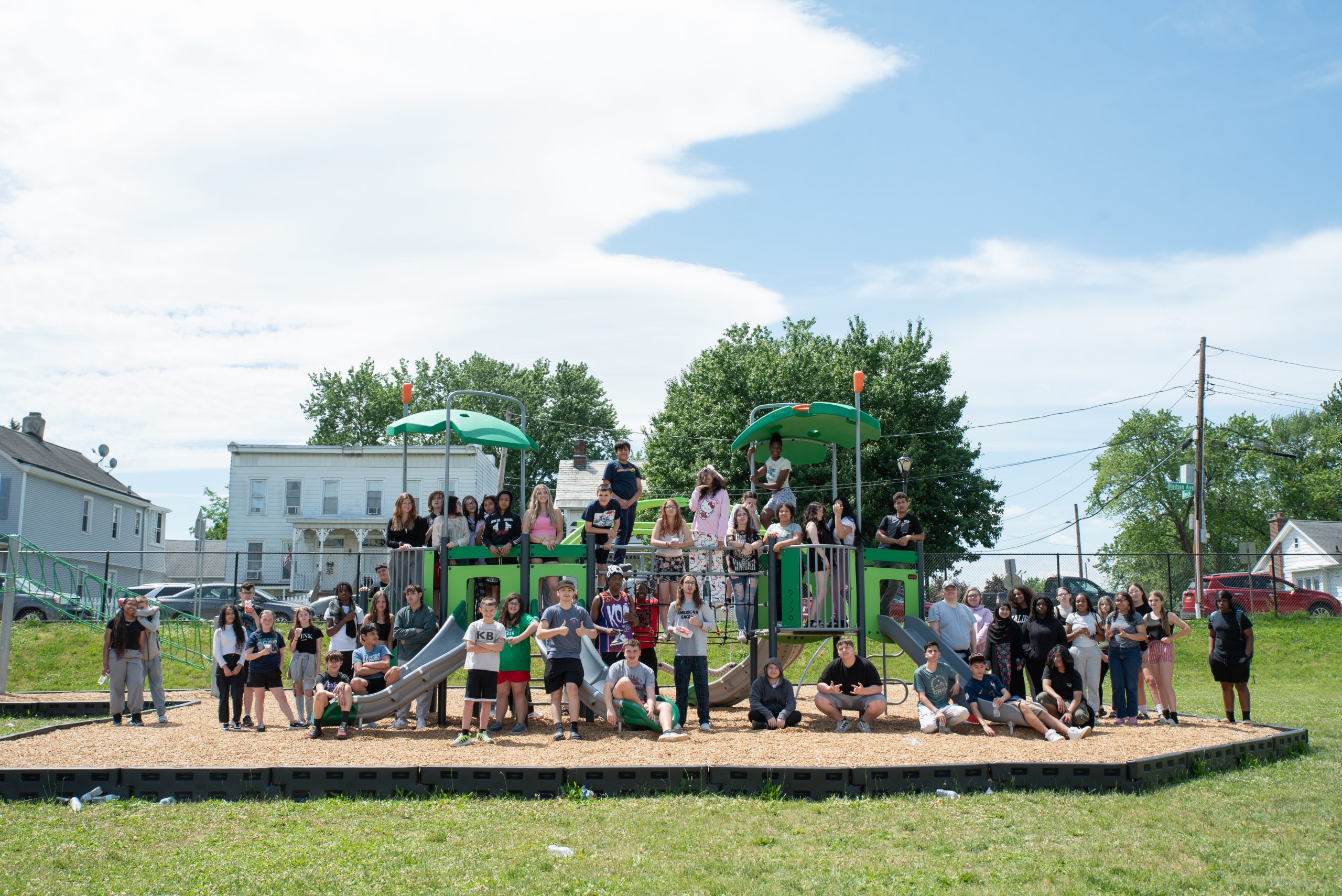 Group of Heatly Students stand at the park