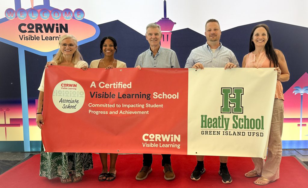 Group of administrators pose with award.