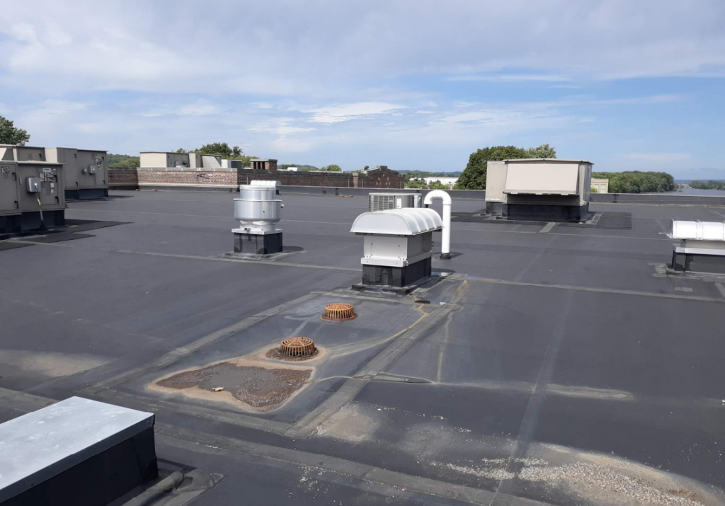 aged roof with broken equipment.